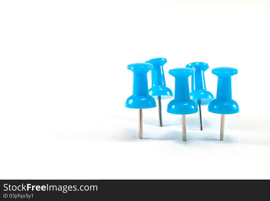 Close up of a pushpin on white background. Close up of a pushpin on white background