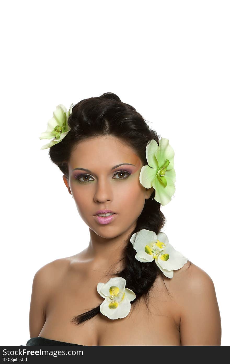 Attractive young beautiful natural model woman with orchid flower on head with hairstyle and eye makeup isolated over white background. Spring, summer girl, concept of healthy lifestyle metaphor. Attractive young beautiful natural model woman with orchid flower on head with hairstyle and eye makeup isolated over white background. Spring, summer girl, concept of healthy lifestyle metaphor