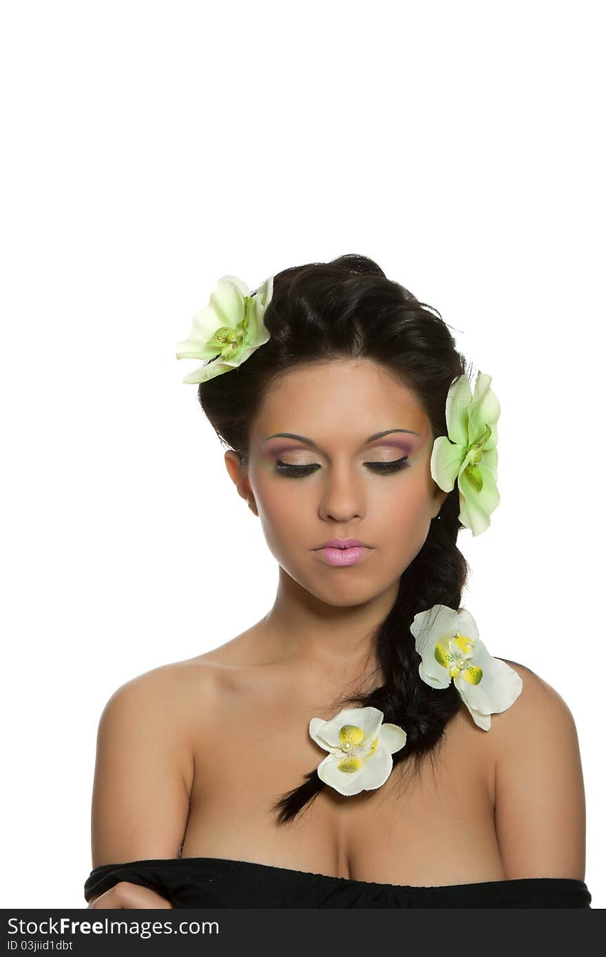 Attractive young beautiful natural model woman with orchid flower on head with hairstyle and eye makeup isolated over white background. Spring, summer girl, concept of healthy lifestyle metaphor. Attractive young beautiful natural model woman with orchid flower on head with hairstyle and eye makeup isolated over white background. Spring, summer girl, concept of healthy lifestyle metaphor