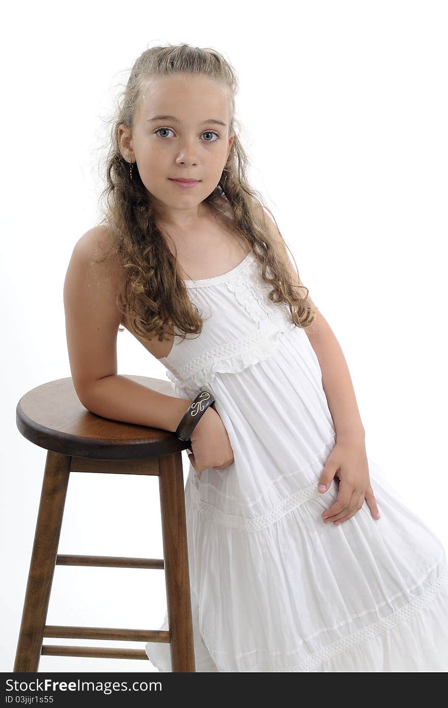 Beautiful  girl posing near chair