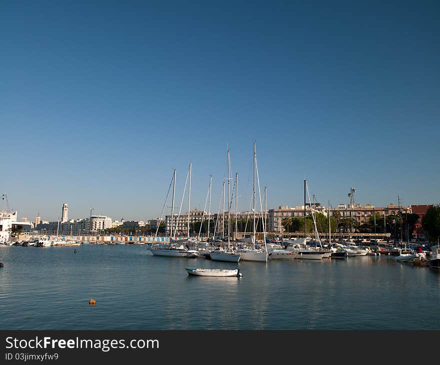 Coast of Italy. Port with a group of sport yachts and waterfront homes and trees