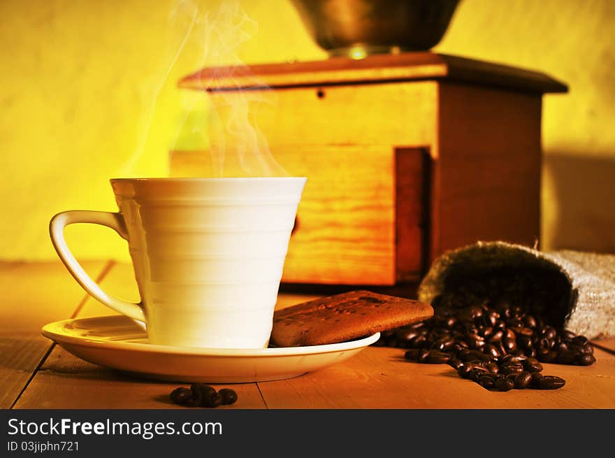 Coffee, coffee beans and coffee grinder on the table. Coffee, coffee beans and coffee grinder on the table