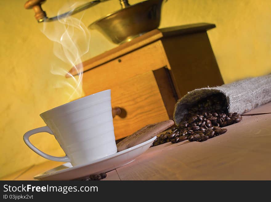 Coffee, coffee beans and coffee grinder on the table. Coffee, coffee beans and coffee grinder on the table