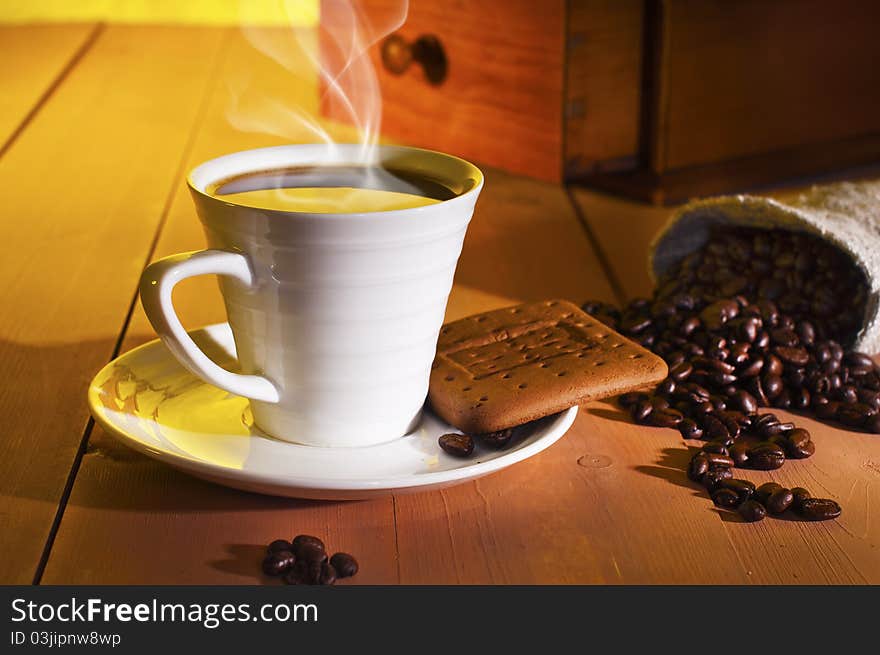 Coffee, coffee beans and coffee grinder on the table. Coffee, coffee beans and coffee grinder on the table