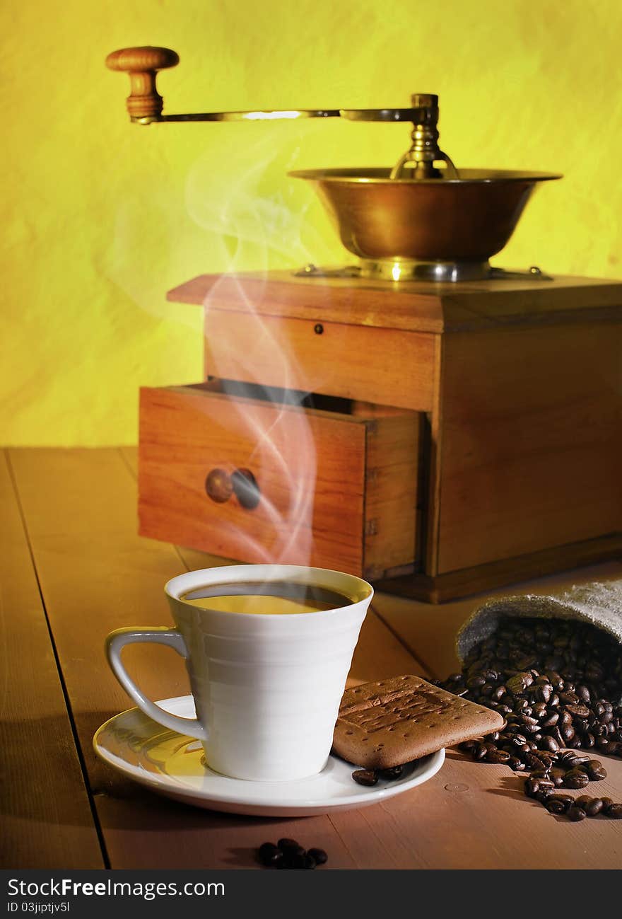 Coffee, coffee beans and coffee grinder on the table. Coffee, coffee beans and coffee grinder on the table