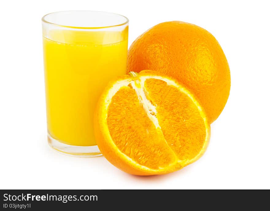 Orange jusice in glass and two oranges on white background. Orange jusice in glass and two oranges on white background