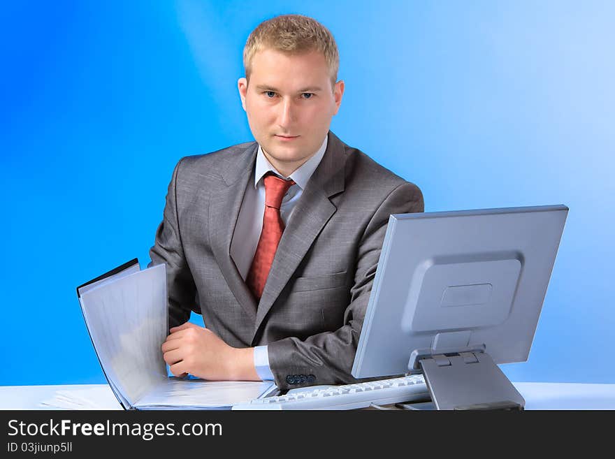 Young successful business man with a document case and computer