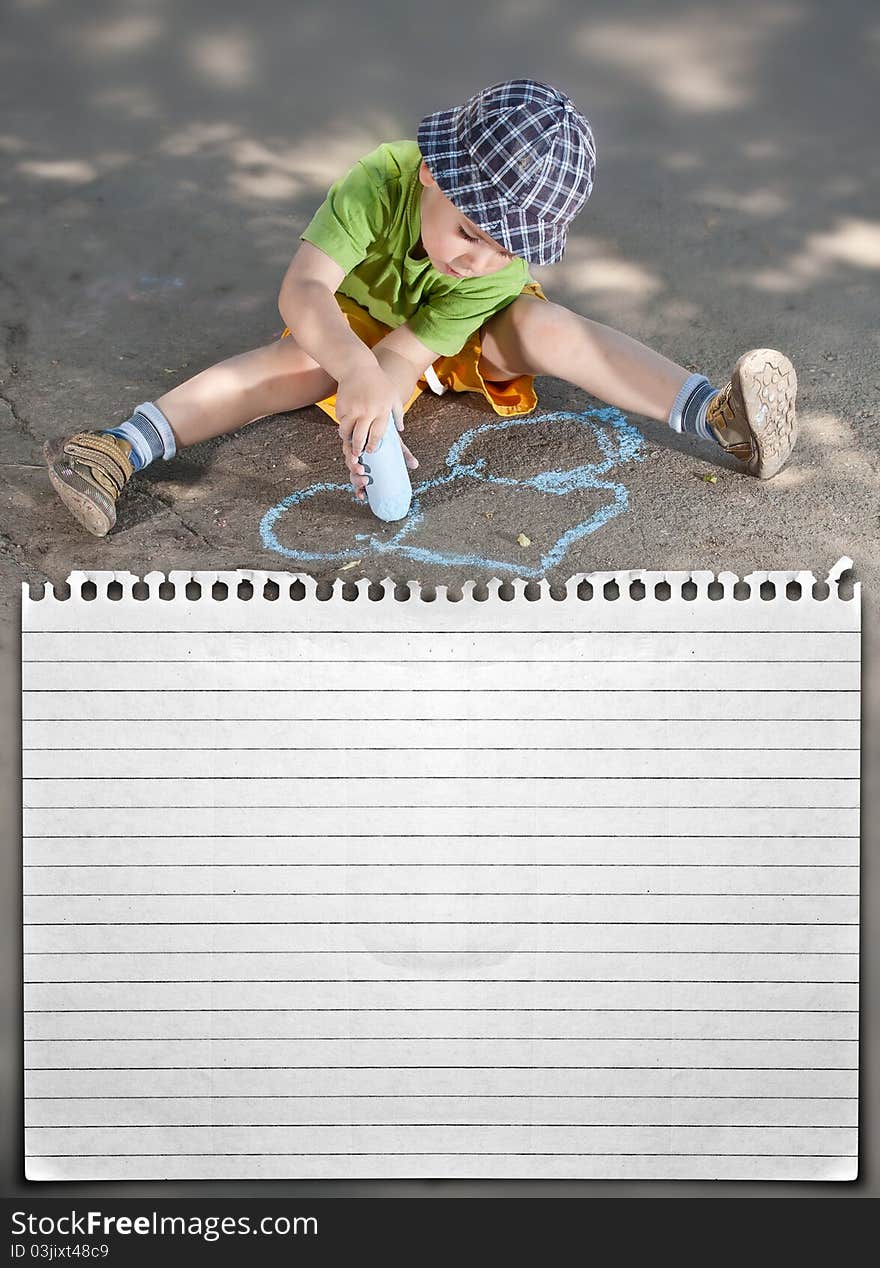 Boy drawing with chalk on asphalt