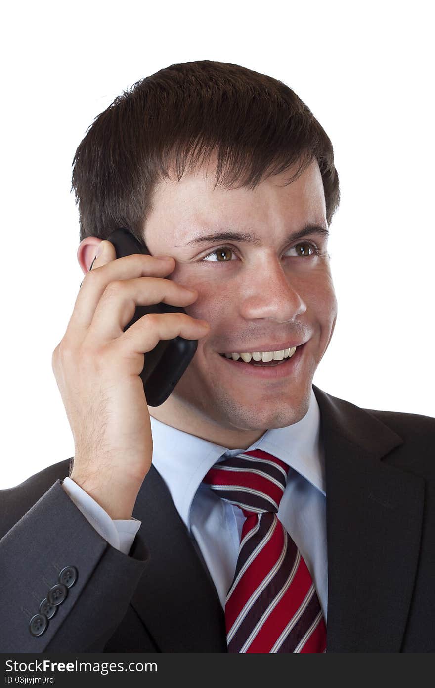 Close-up of a young businessman phoning happily with mobile. Isolated on white background. Close-up of a young businessman phoning happily with mobile. Isolated on white background.