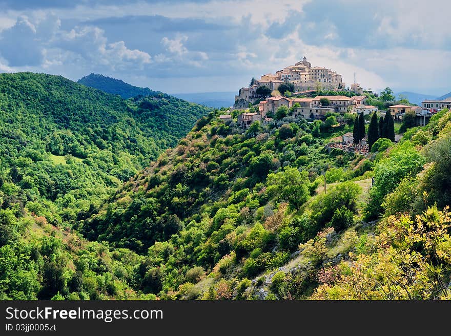 Picturesque little town on the top of hill, Italy