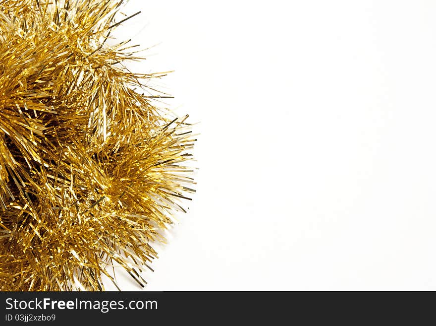 Yellow tinsel on white background