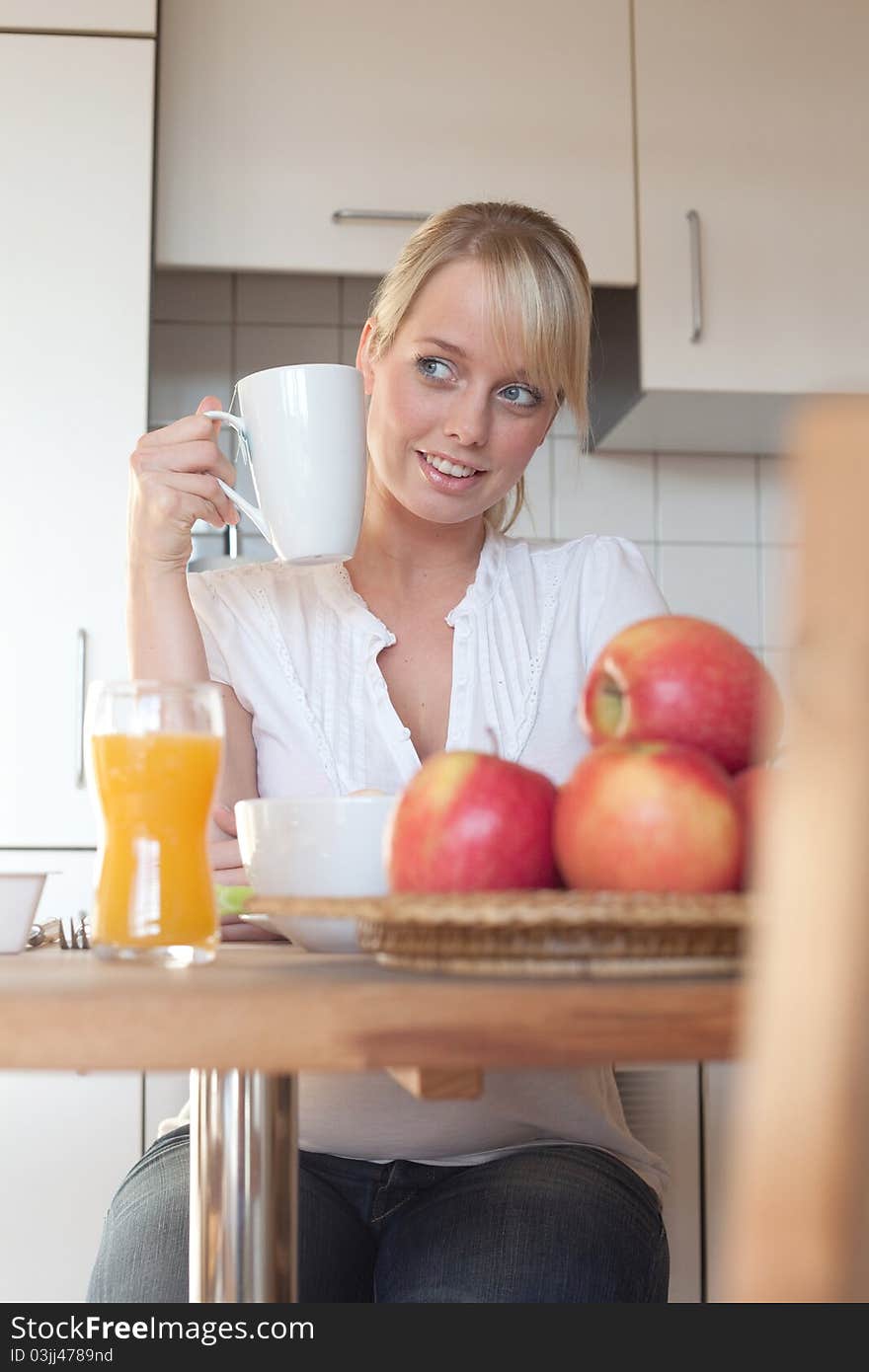 Young Blond Woman With Her Breakfast