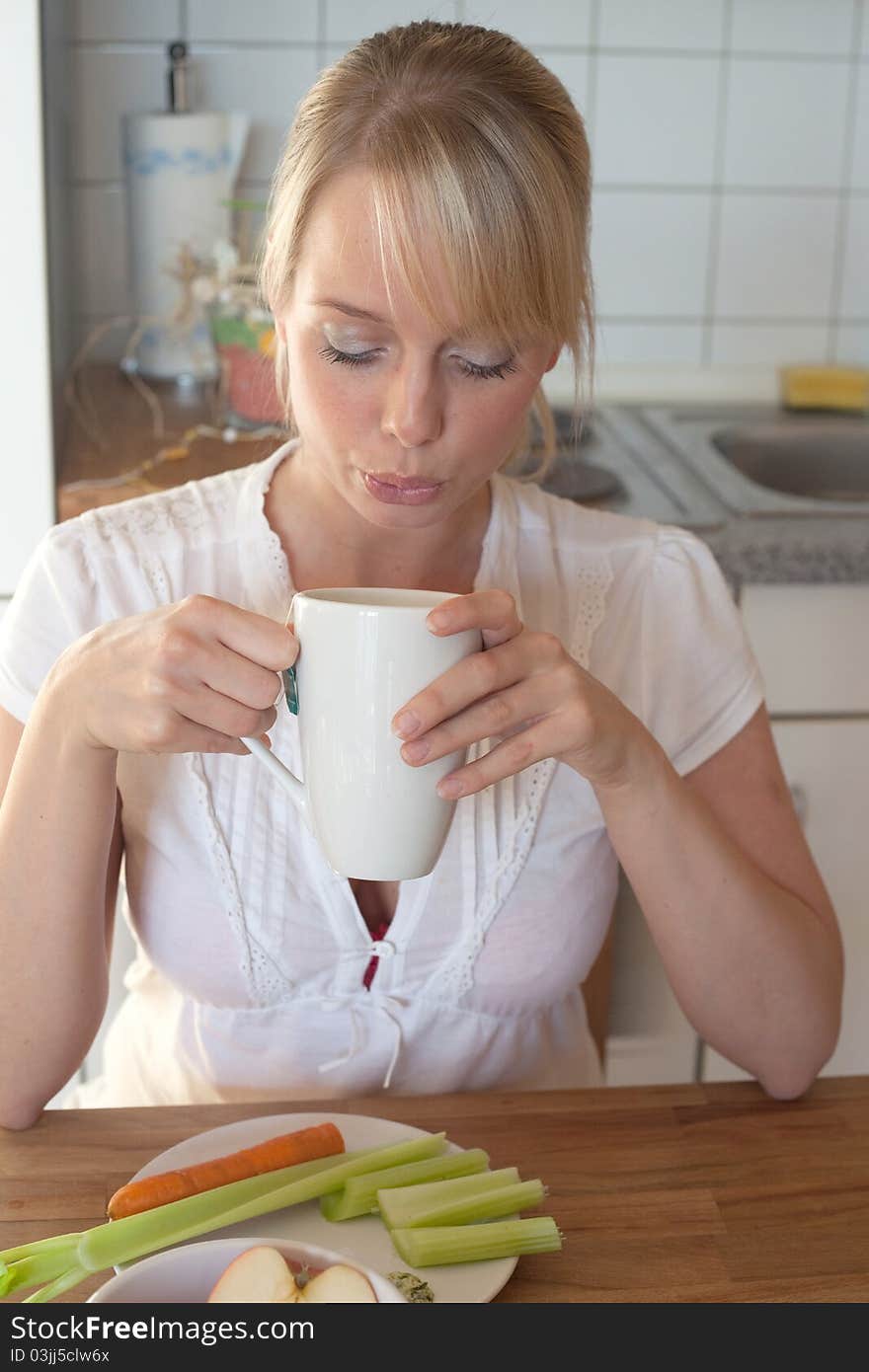 Young Blond Woman With Her Breakfast