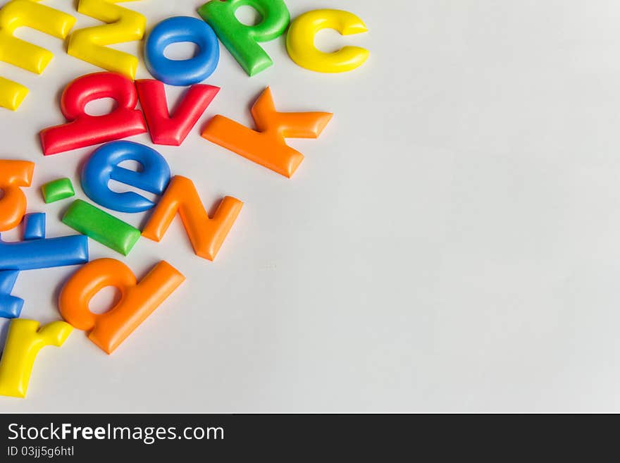 The colorful random letters on the white background. The colorful random letters on the white background