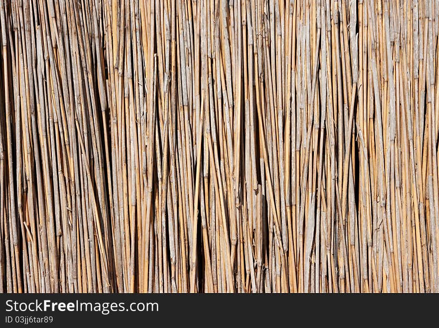 A reed umbrella on beach