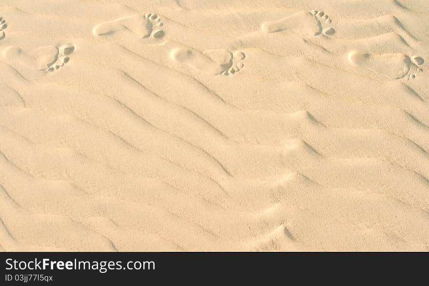 Foot marks on a sand dune. Foot marks on a sand dune