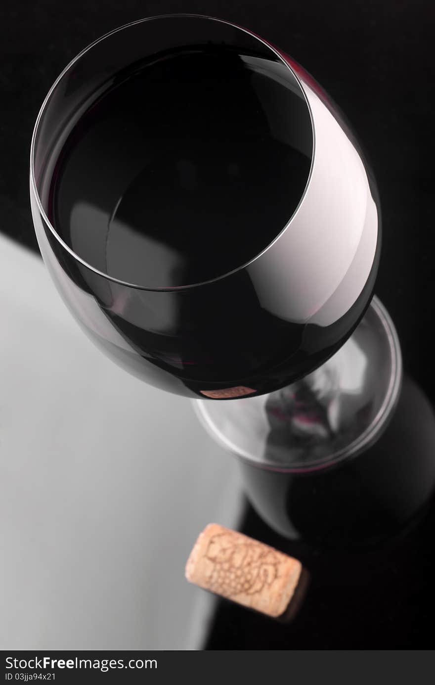 Glass of red wine and wine cork. Glass of red wine and wine cork