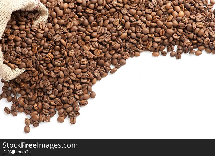 Coffee beans and burlap sack isolated on white