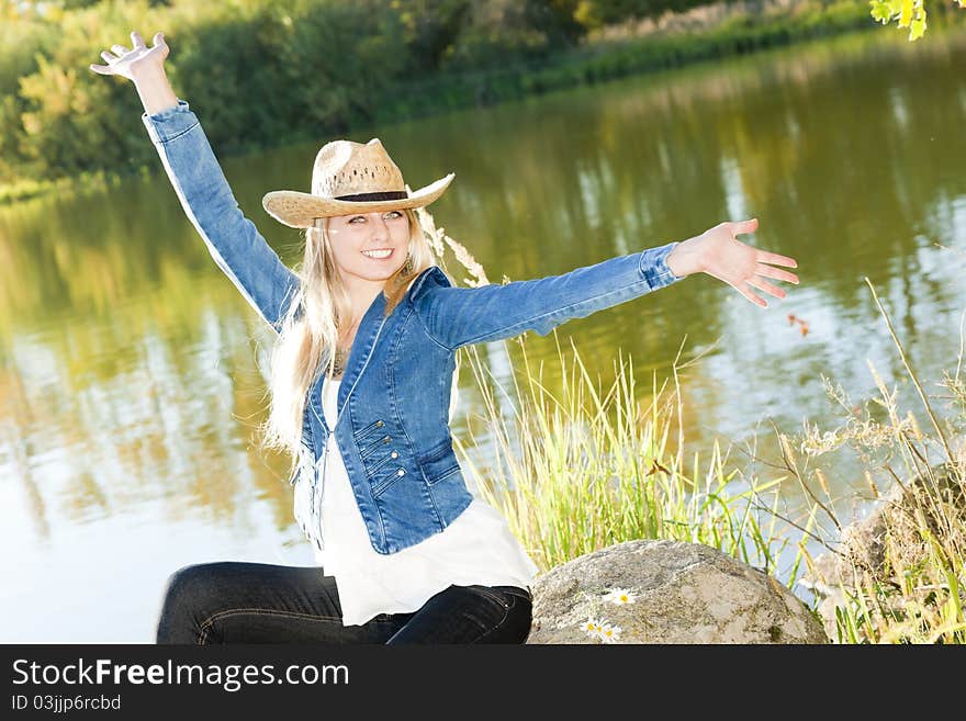 Woman Sitting On Stone