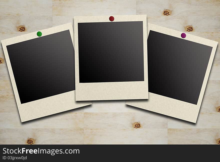 Blank photos on a wood background