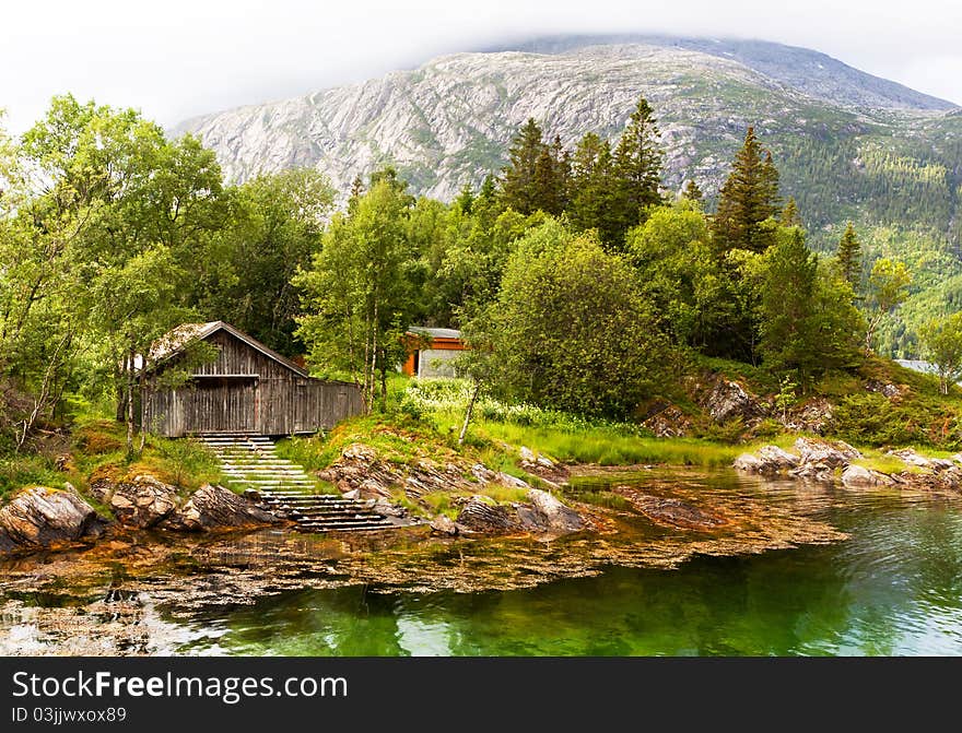 Among mountains and clouds in a Norwegian fjord. Among mountains and clouds in a Norwegian fjord.