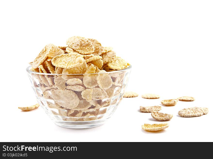 Bowl of dried cornflakes on white