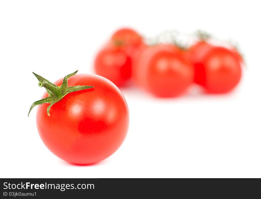 Red tomatoes on a white background