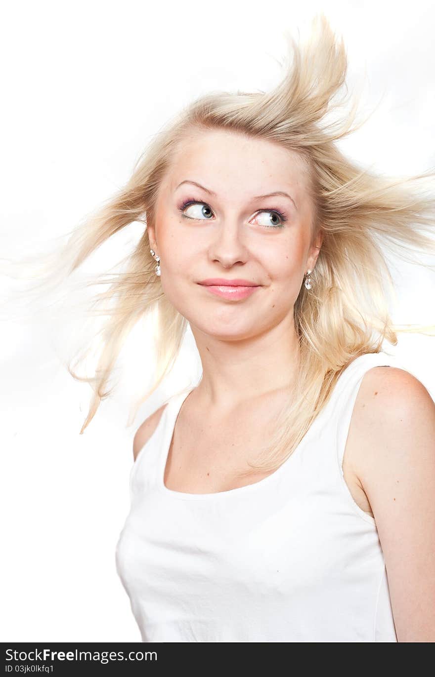 Beautiful blonde with a flying hair. Isolated on white background