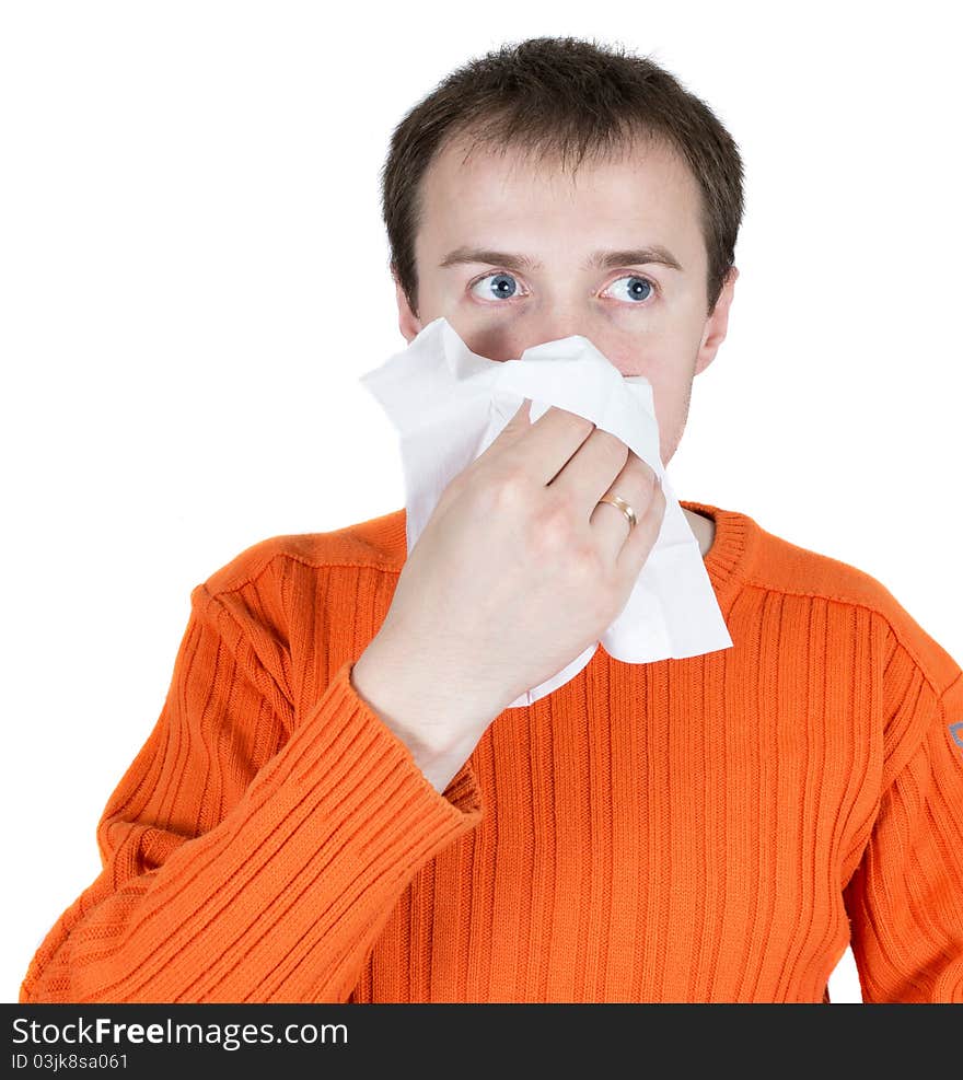 The young man wipes a nose a scarf isolated