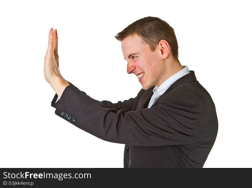 Young businessman pushing up on an isolated background