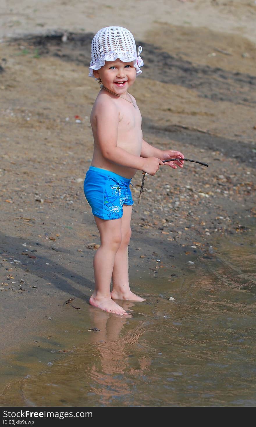 Little girl is smiling on the beach. Little girl is smiling on the beach