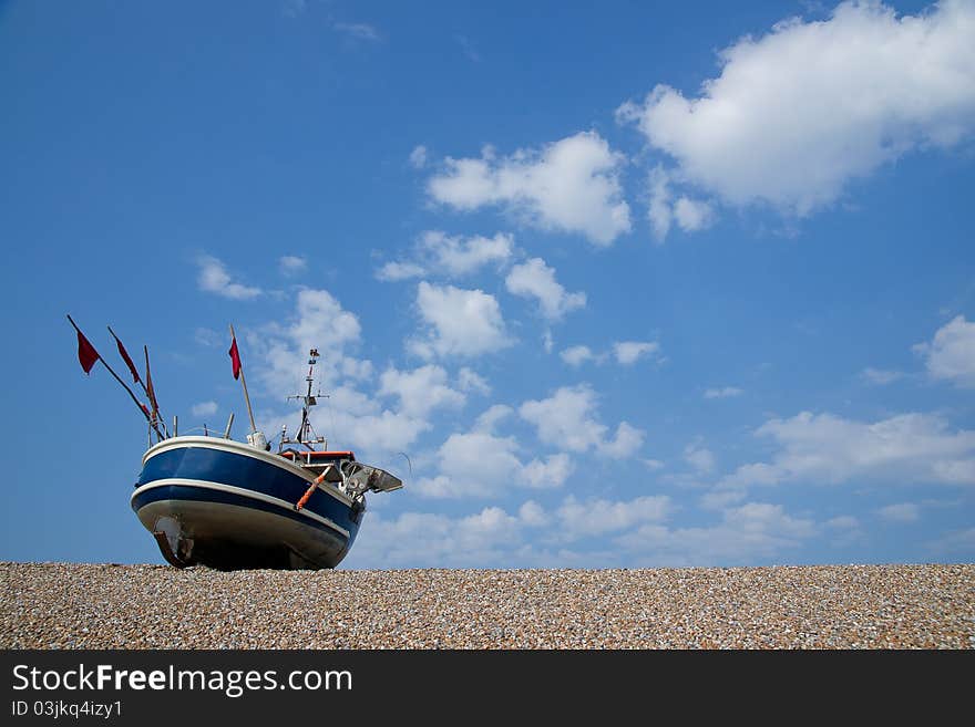 Fishing boat on a pebble beach