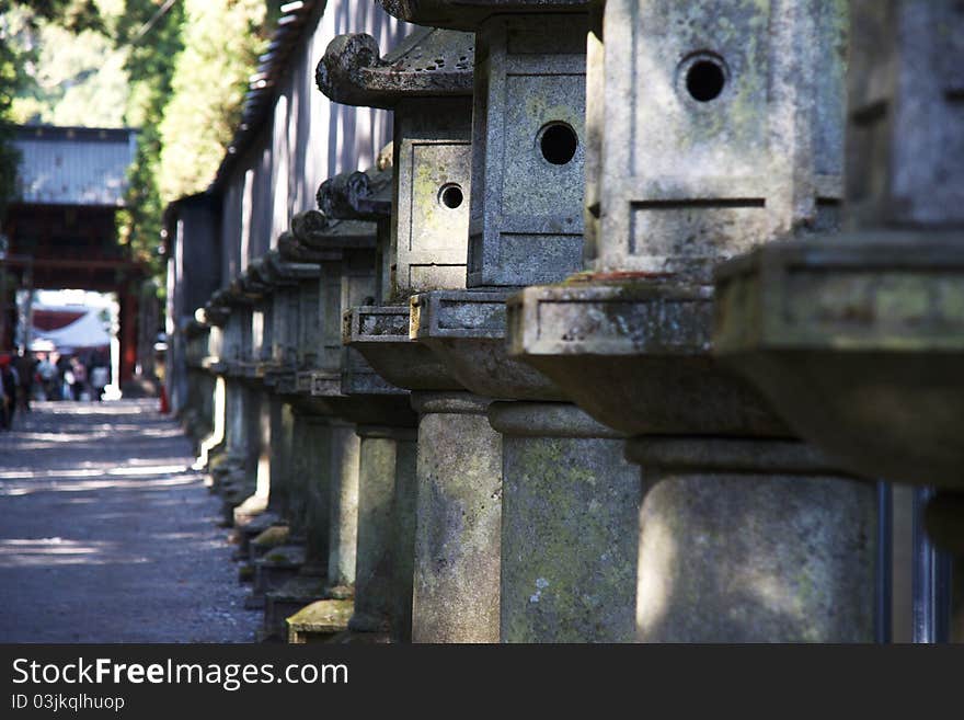 Mausoleums of the Tokugawa Shoguns in nikko at autumn with red leaves