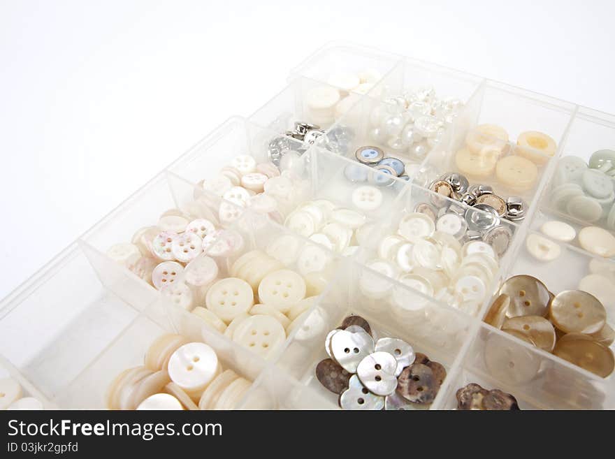 A box of buttons beads.