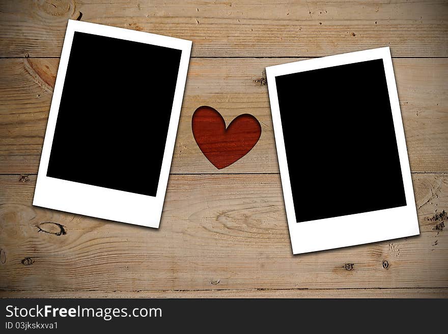 2 Instant photos with red heart on wooden wall