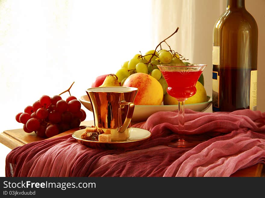 Fruits,red Wine,coffee Cup On Blurred Background.