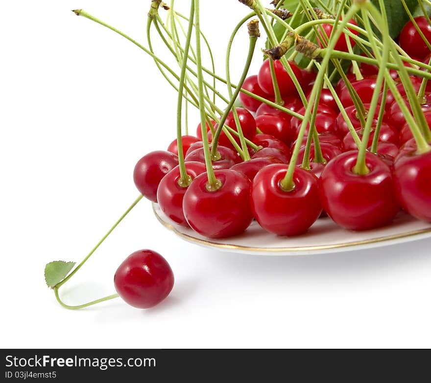 Cherry With A Branch On A Dish