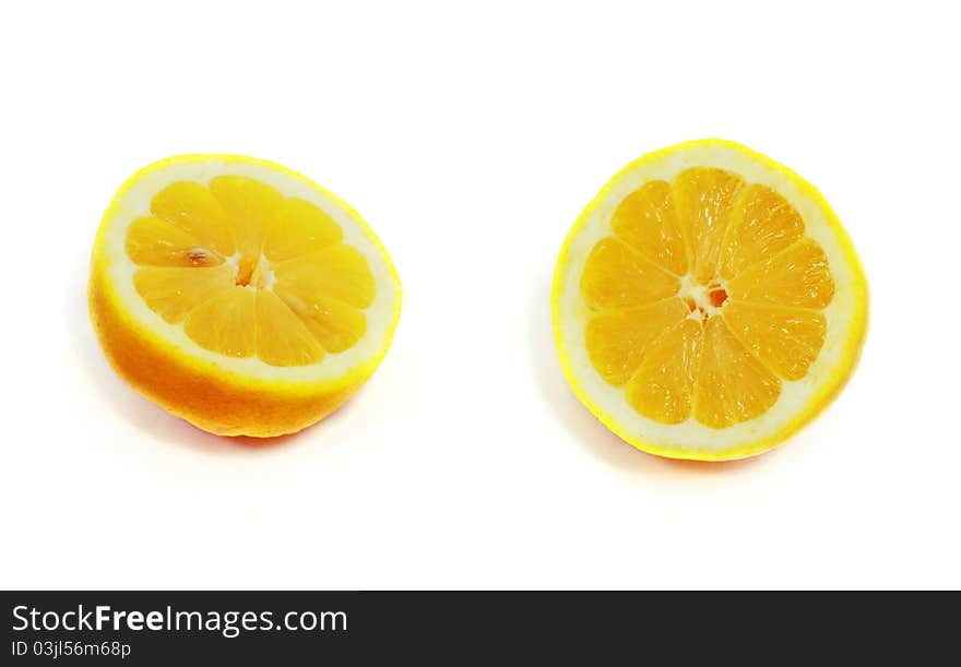 Fresh juicy cut lemon isolated on white background