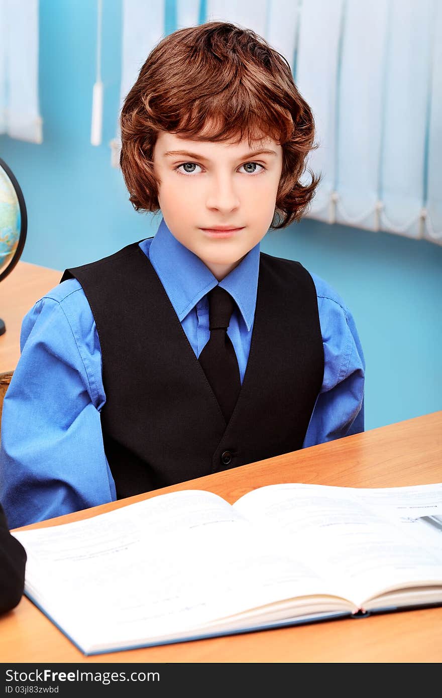 Portrait of a schoolboy in a classroom. Portrait of a schoolboy in a classroom.