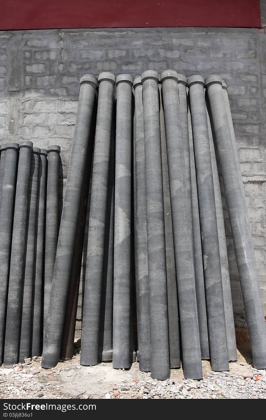 Asbestos pipes in construction warehouse.