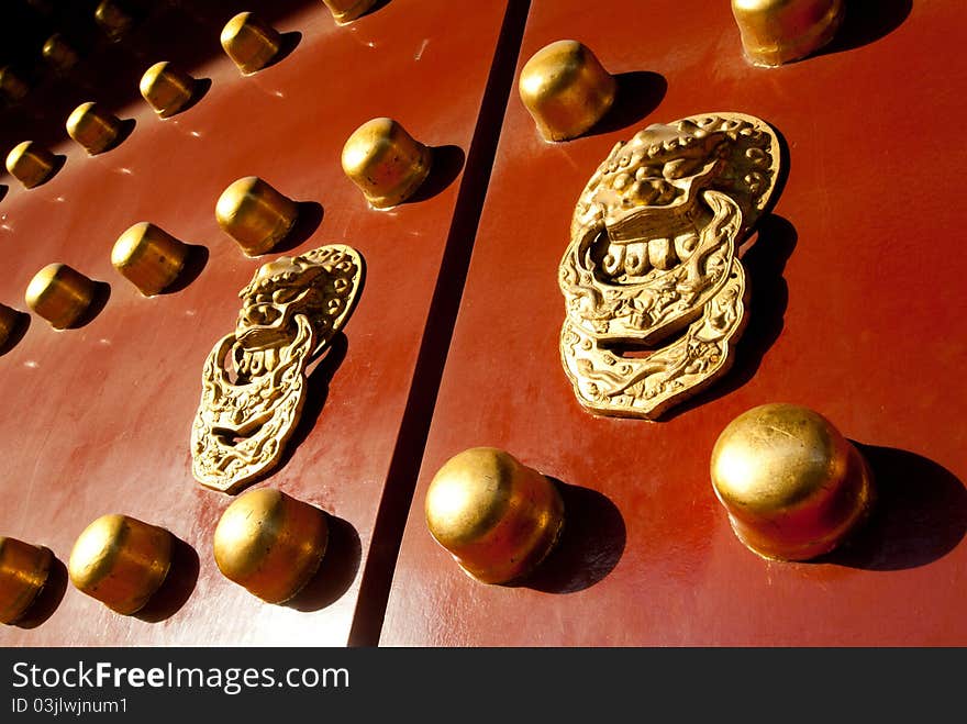 Red chinese door with a lion/dragon head