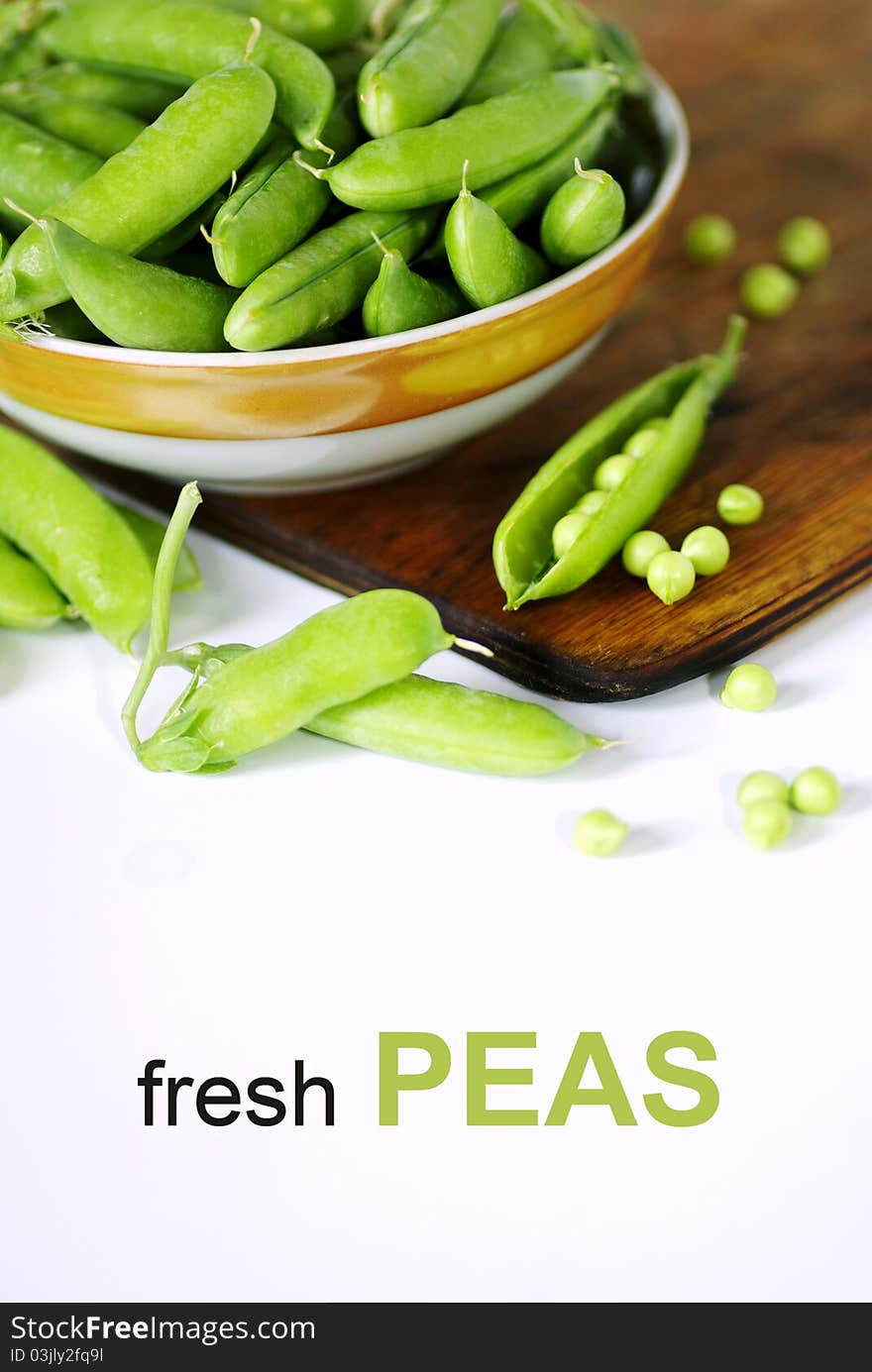 Fresh green peas isolated on white background