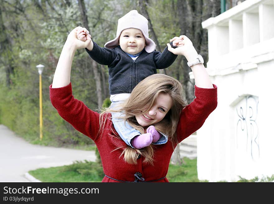 Happy mother and baby in park