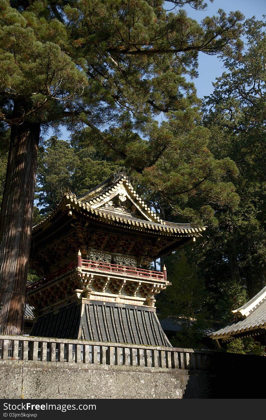 Mausoleums of the Tokugawa Shoguns in nikko at autumn with red leaves