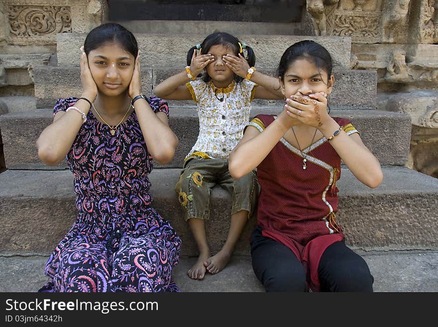 Girls enacting concept of Hear no evil, see no evil and speak no evil. Girls enacting concept of Hear no evil, see no evil and speak no evil