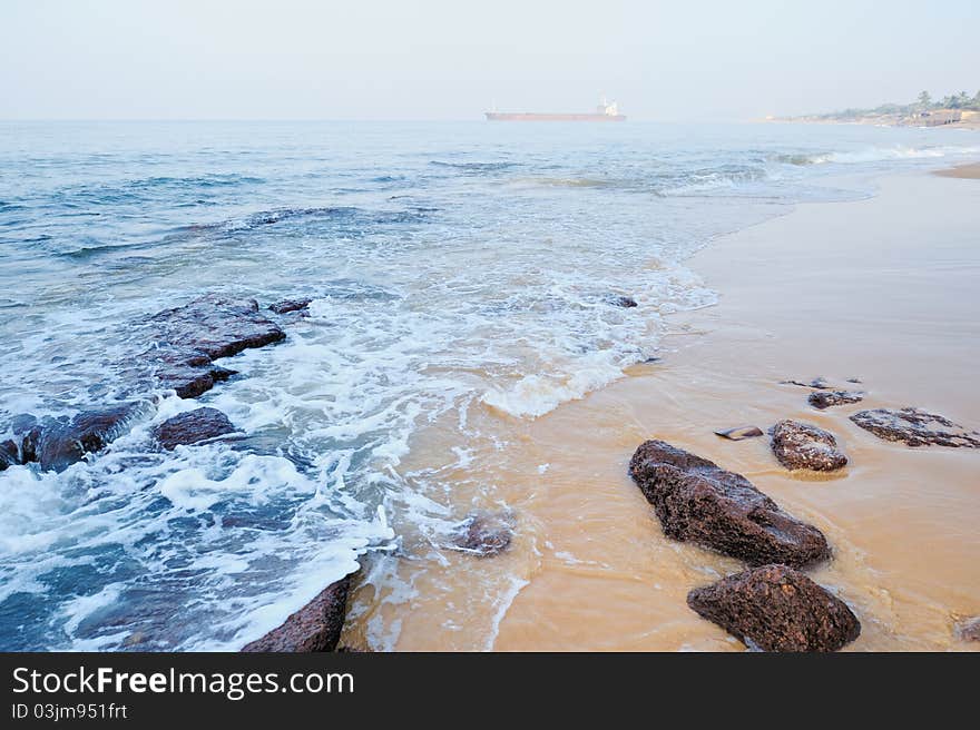 Smooth wave on the sandy beach in the morning. Smooth wave on the sandy beach in the morning