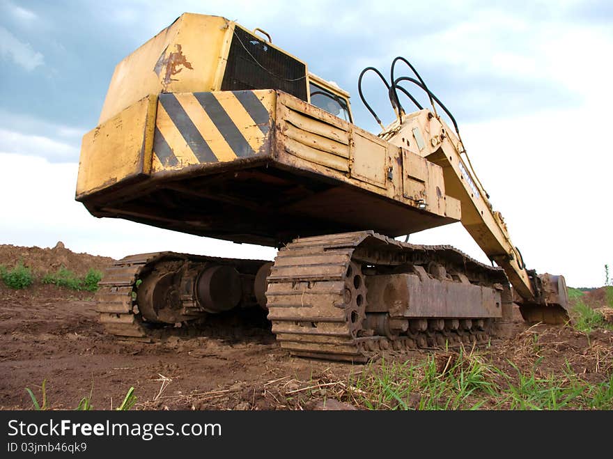 Digger, Heavy Duty construction equipment parked at work site