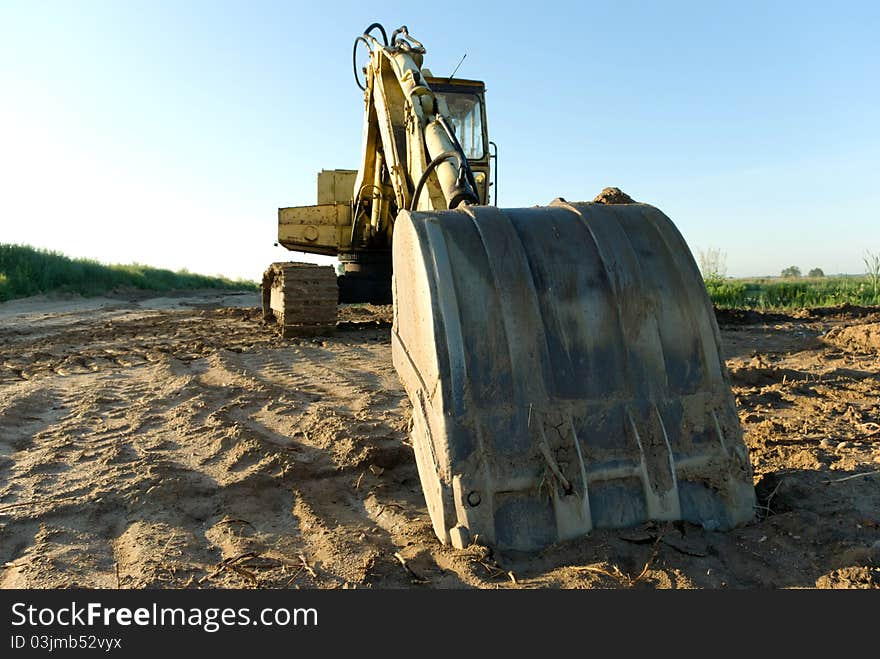 Digger, Heavy Duty construction equipment parked at work site