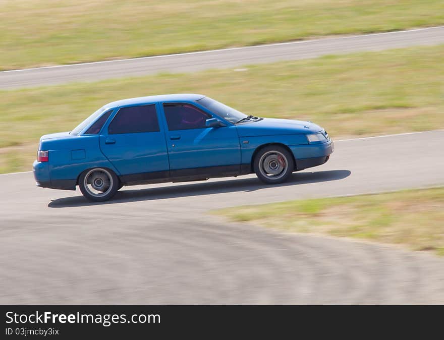 Fast blue car in a race. Fast blue car in a race