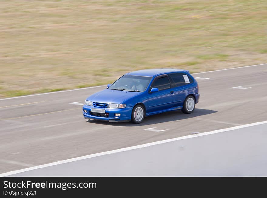 Fast blue car in a race. Fast blue car in a race